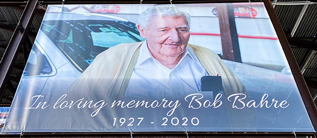 A banner on the Main Grandstand is just one way the late track founder and New England motorsports pioneer, Bob Bahre, is being honored during the NASCAR Cup Series Foxwoods Resort Casino 301 at New Hampshire Motor Speedway this weekend. (NHMS Photo)