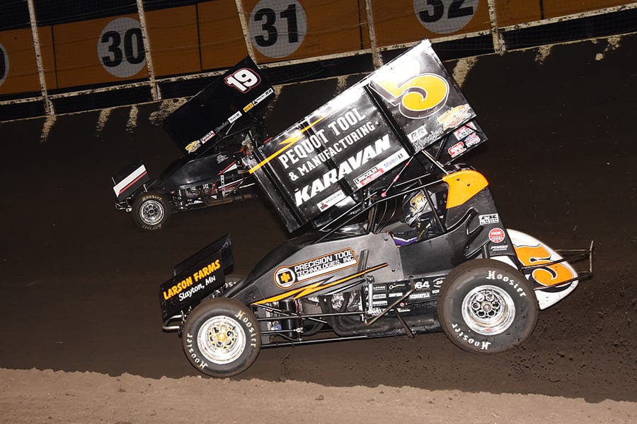 Ian Madsen (5) chases Paige Polyak during Sunday's Ollie's Bargain Outlet All Star Circuit of Champions event at Huset's Speedway. (Paul Arch Photo)