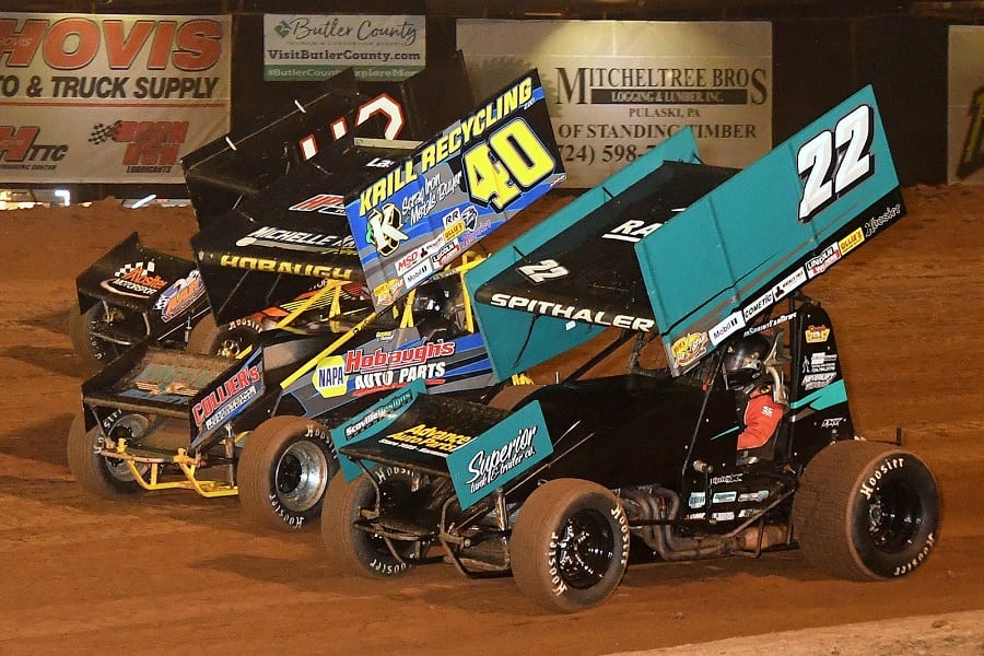 Brandon Spithaler (22) duels with George Hobaugh (40) and Sye Lynch during Friday's 410 sprint car program at Lernerville Speedway. (Hein Brothers photo)