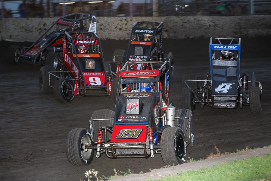 Ace McCarthy leads a gaggle of cars during Friday's POWRi Lucas Oil National Midget League event at Lincoln (Ill.) Speedway. (Brendon Bauman photo)