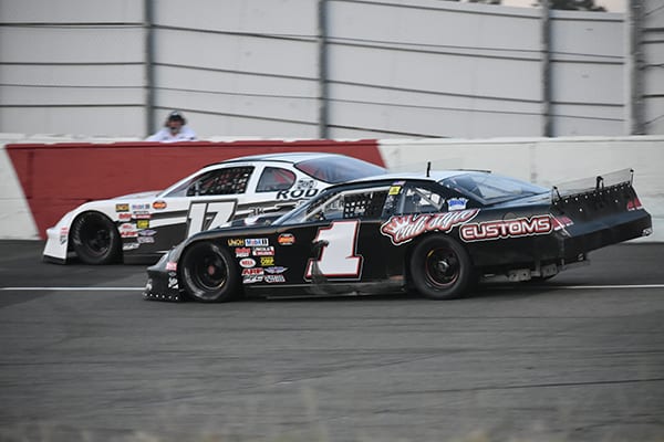 Matt Wendt (#1) and Angelina Dempsey battle in NASCAR Late Model action at All American Speedway. (Don Thompson Photo)