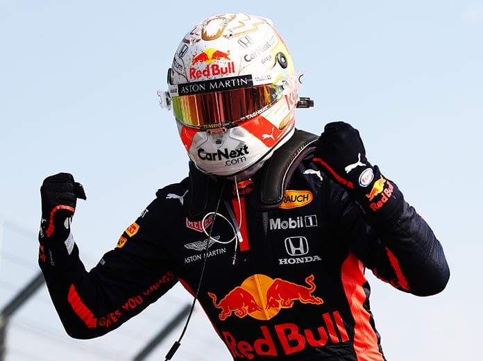 Max Verstappen celebrates after winning Sunday's 70th Anniversary Grand Prix at the Silverstone Circuit. (Bryn Lennon/Getty Images Photo)