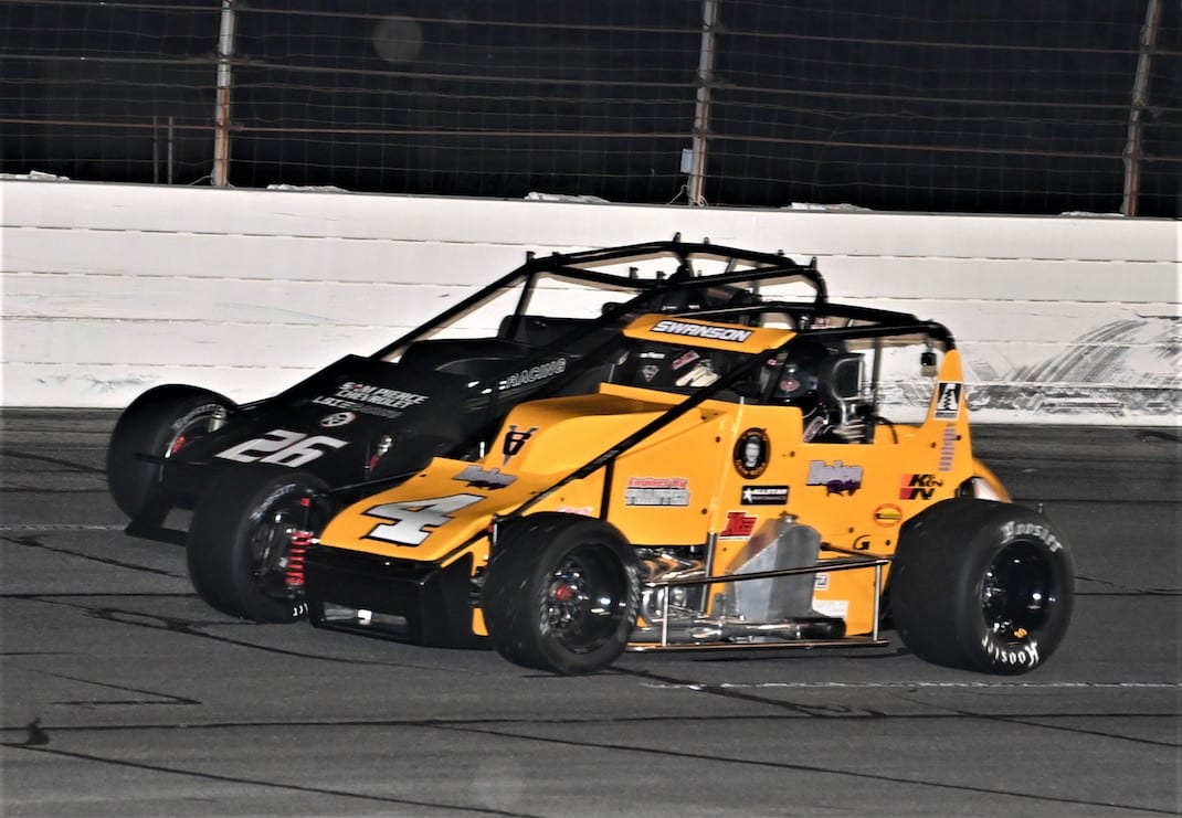 Kody Swanson (4) races under Aaron Pierce at Lucas Oil Raceway. (Al Steinberg photo)