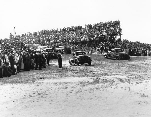 A huge crowd was on hand to watch the first organized stock car race to be held on the Daytona Beach Road Course in 1936. Despite the overflow of fans, Daytona Beach city officials estimated they lost around $20,000 staging the event. (ISC Archives via Getty Images)