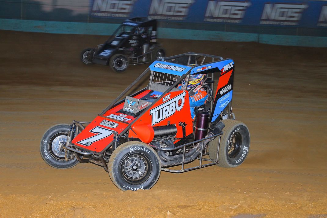 Tyler Courtney (7) races under Chase Johnson at Action Track USA. (Dan Demarco photo)