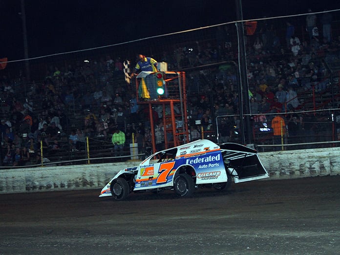 Nick Hoffman takes the checkered flag to win Tuesday's DIRTcar Summit Racing Equipment Modified Nationals feature at Sycamore Speedway. (Jim Denhamer Photo)