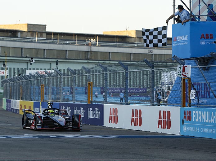 Oliver Rowland crosses the finish line to win Wednesday's Formula E event in Berlin, Germany. (Andrew Ferraro / LAT Images Photo)
