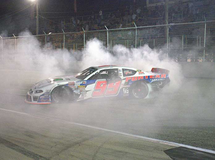 Layne Riggs celebrates with a burnout after his CARS Late Model Stock Tour victory Saturday at Langley Speedway.