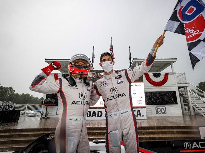 Helio Castroneves and Ricky Taylor reigned in the rain Sunday at Road America. (IMSA photo)