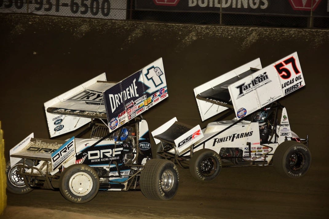 Kyle Larson (57) battles Jacob Allen for the lead at Federated Auto Parts Raceway at I-55. (Mark Funderburk photo)