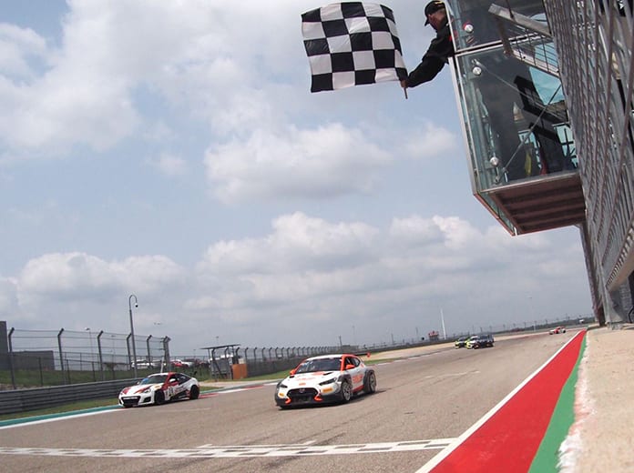 Tyler Maxson takes the checkered flag to win Saturday's TC America event at Circuit of the Americas.
