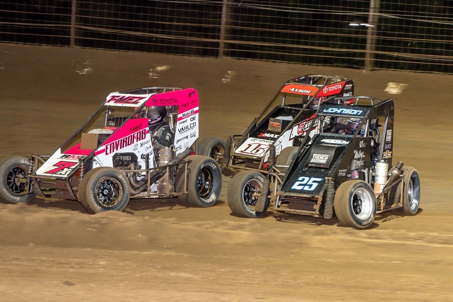 Thomas Meseraull (7x), Chase Johnson (25) and Emerson Axsom race for position during Saturday's USAC National Midget Series feature at Sweet Springs Motorsports Complex. (Mark Coffman photo)