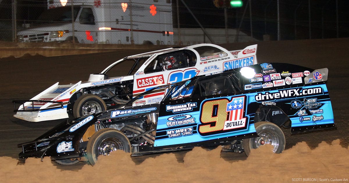 Zack VanderBeek (33Z) and Joe Duvall (91) battle side by side on the opening lap of Friday night's USMTS feature at Ark-La-Tex Speedway. (Scott Burson Photo)