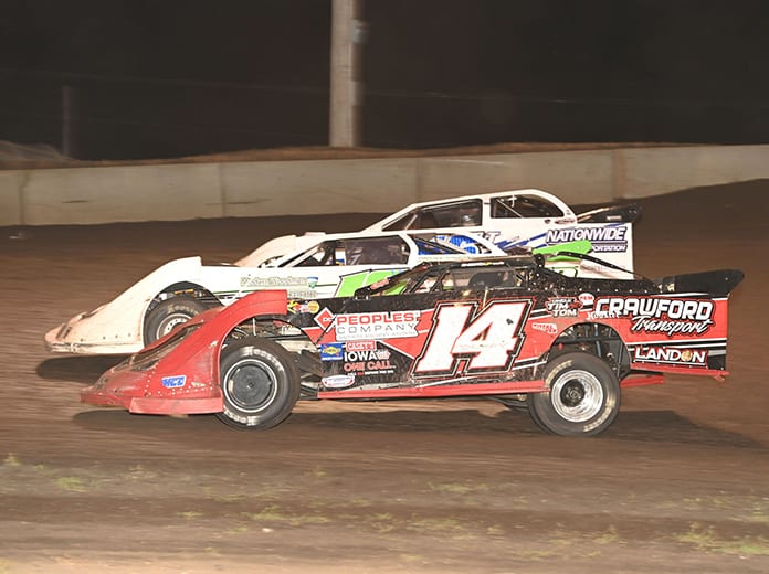 Drivers battle for position during Monday's IMCA Speedway Motors Super Nationals late model main event at Boone Speedway. (Tom Macht Photo)