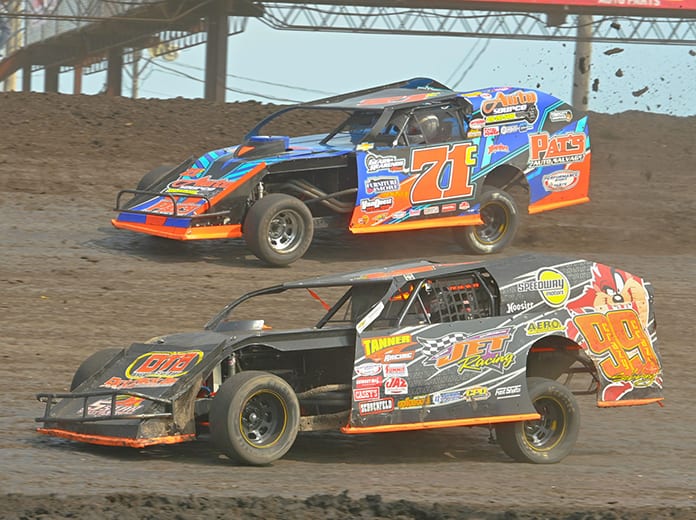 Jesse Sobbing (999) battles Troy Cordes during the IMCA modified Race of Champions on Sunday during the IMCA Speedway Motors Super Nationals at Boone Speedway. (Tom Macht Photo)