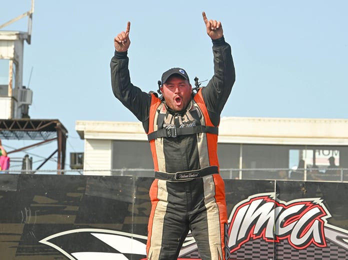 Nathan Ballard celebrates after winning the hobby stock feature during the IMCA Speedway Motors Super Nationals Sunday at Boone Speedway. (Tom Macht Photo)