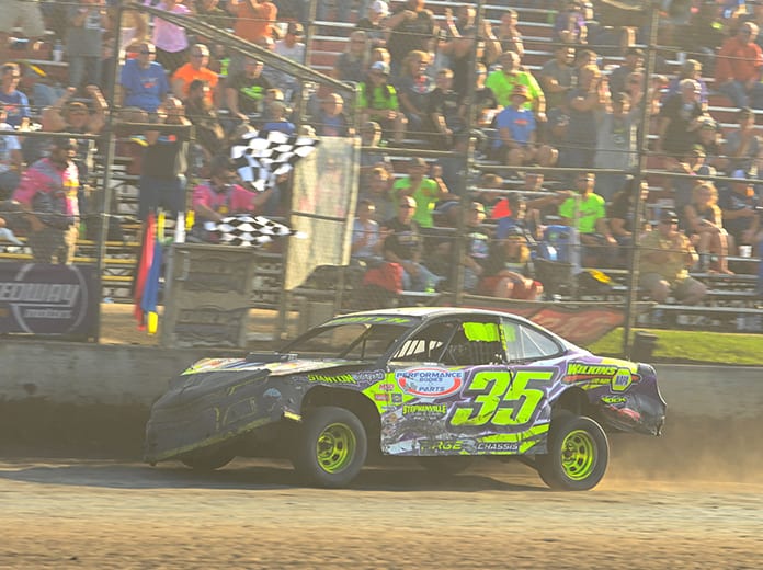 Donavon Smith crosses the finish line to win the IMCA Speedway Motors Super Nationals stock car finale Sunday at Boone Speedway. (Tom Macht Photo)