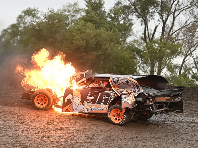 Chance Huston escaped injury in a bizarre accident Monday on the opening day of competition at the IMCA Speedway Motors Super Nationals. (Tom Macht Photo)