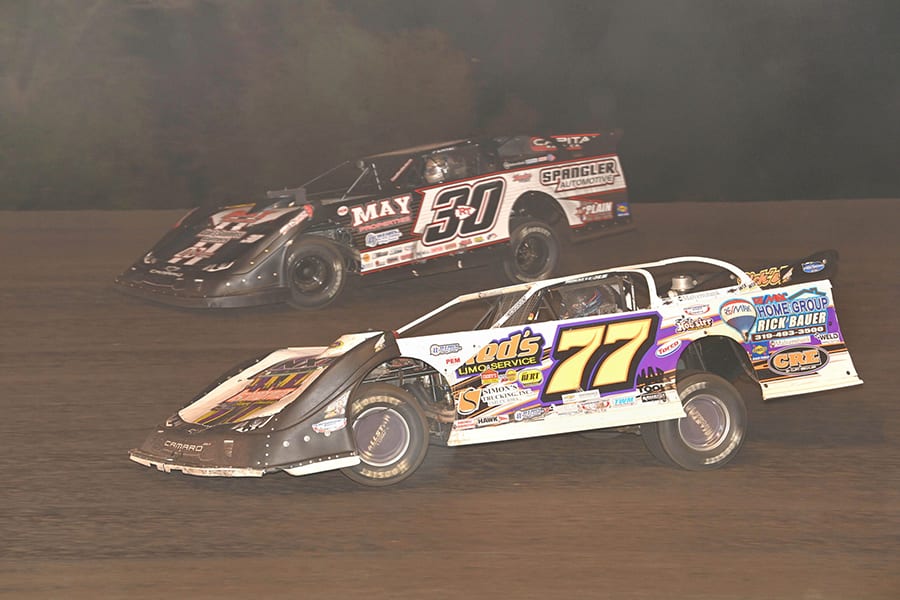 Jeff Aikey (77) and Ricky Thornton Jr. battle for the lead during Monday's IMCA Speedway Motors Super Nationals late model championship feature at Boone Speedway. (Tom Macht Photo)