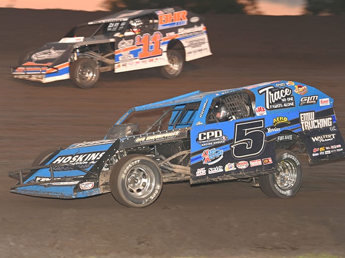 Todd Shute (5) battles Kyle Heckman during the second modified qualifier early Saturday evening at Boone Speedway. (Tom Macht Photo)