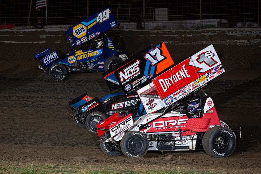 Logan Schuchart (1s), Sheldon Haudenschild (17) and Brad Sweet battle for position during Saturday's World of Outlaws NOS Energy Drink Sprint Car Series event at U.S. 36 Raceway. (Russell Moore Photo)