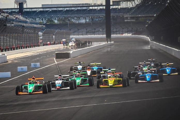 The Indy Pro 2000 field races into turn one Friday on the Indianapolis Motor Speedway road course.