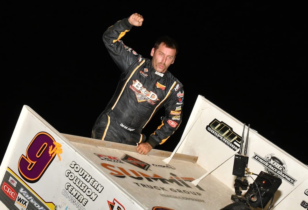 Derek Hagar celebrates victory at Lake Ozark Speedway. (Ken Simon photo)