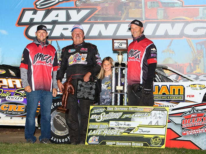 Jeff Aikey added to his career-best total with his 71st Summer Series victory, during the Dale De­France Memorial program at Marshalltown Speedway. He is pictured with IMCA President Brett Root, trophy presenter Dayna Murty and Series Director Kevin Yoder. (Bruce Badgley Photo)
