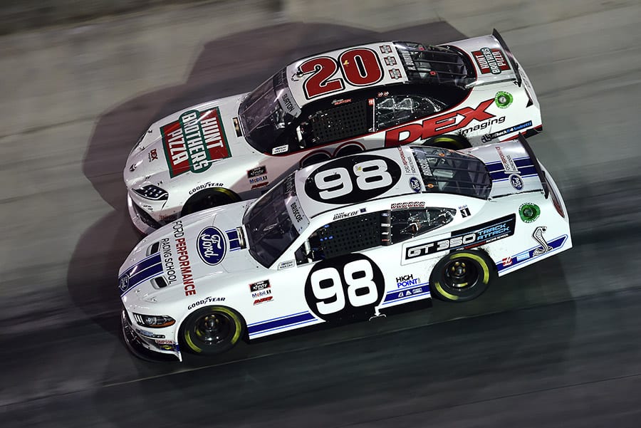 Chase Briscoe (98) races under Harrison Burton during Friday's Food City 300 at Bristol Motor Speedway. (Jared C. Tilton/Getty Images)