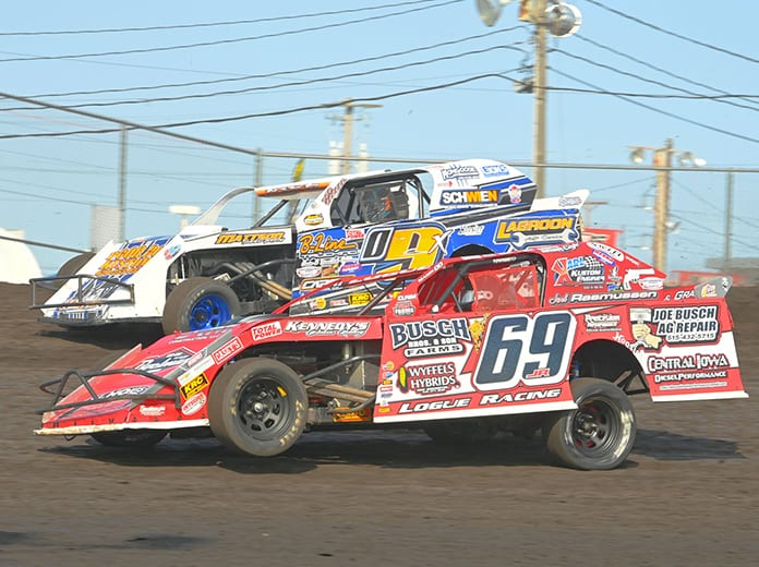 Johnathon Logue (69) battles alongside Brett Berry during the Northern sportmod feature during the IMCA Speedway Motors Super Nationals Sunday at Boone Speedway. (Tom Macht Photo)