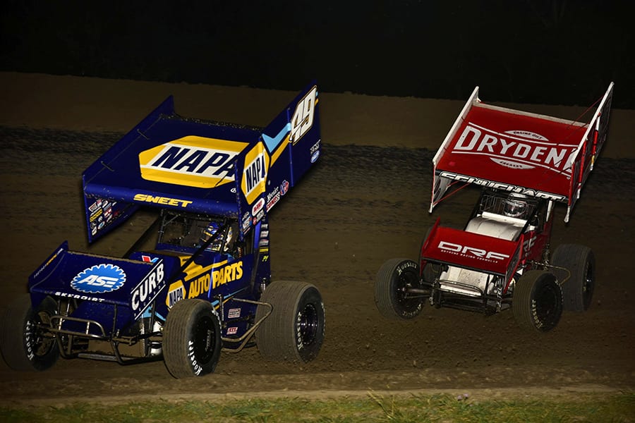 Brad Sweet (49) leads Logan Schuchart during Saturday's World of Outlaws NOS Energy Drink Sprint Car Series event at U.S. 36 Raceway. (Mark Funderburk Photo)