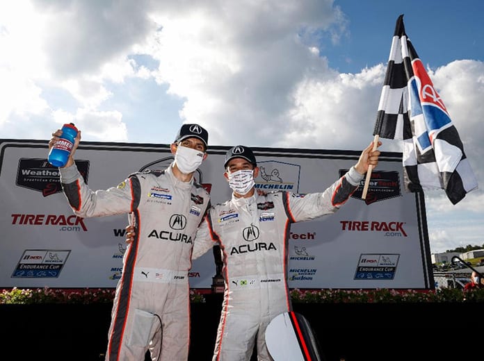 Helio Castroneves and Ricky Taylor came back from two penalties to win Saturday's TireRack.com Grand Prix at Michelin Raceway Road Atlanta. (IMSA Photo)