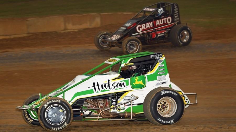 Chase Stockon charges under Dave Darland at Lincoln Park Speedway. (David Nearpass photo)