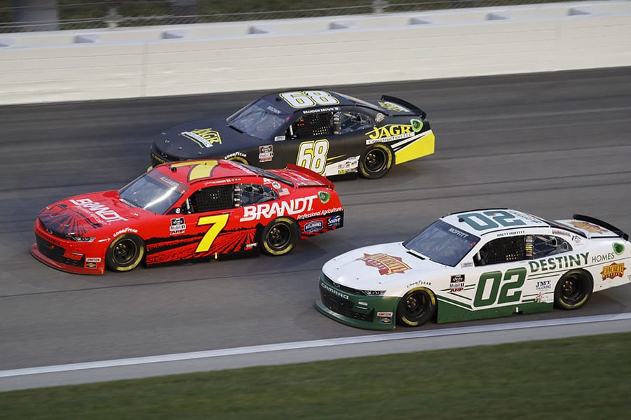 Brett Moffitt (02), Justin Allgaier (7) and Brandon Brown race three-wide during Saturday's NASCAR Xfinity Series event at Kansas Speedway. (HHP/Harold Hinson Photo)
