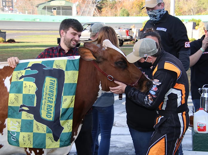Jason Corliss prepares for a kiss with Miss Vermont Milk Bowl after triumphing in the Vermont Milk Bowl for the third time Sunday at Thunder Road Int'l Speedbowl. (Alan Ward Photo)
