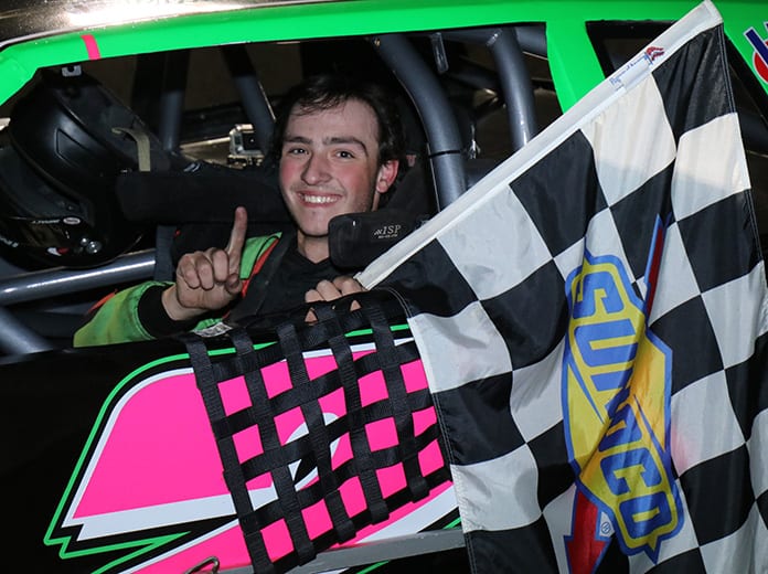 Christopher Buffone was all smiles after capturing the $1,000 winners prize in the Sunoco World Series Street Stock Open. (Matthew Wiernasz/WWLP22 News photo)