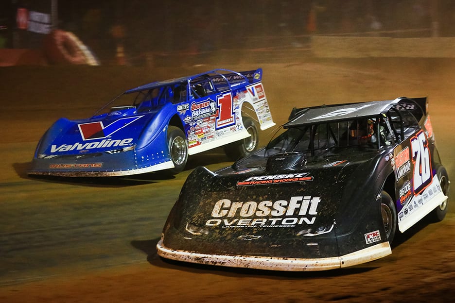 Brandon Overton (76) charges under Brandon Sheppard at Cherokee Speedway. (Zachary Kloosterman photo)