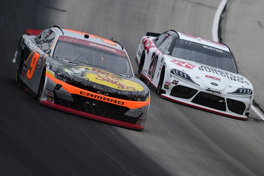 Noah Gragson (9) battles Harrison Burton for the race lead during Saturday's NASCAR Xfinity Series event at Texas Motor Speedway. (Jared C. Tilton/Getty Images Photo)