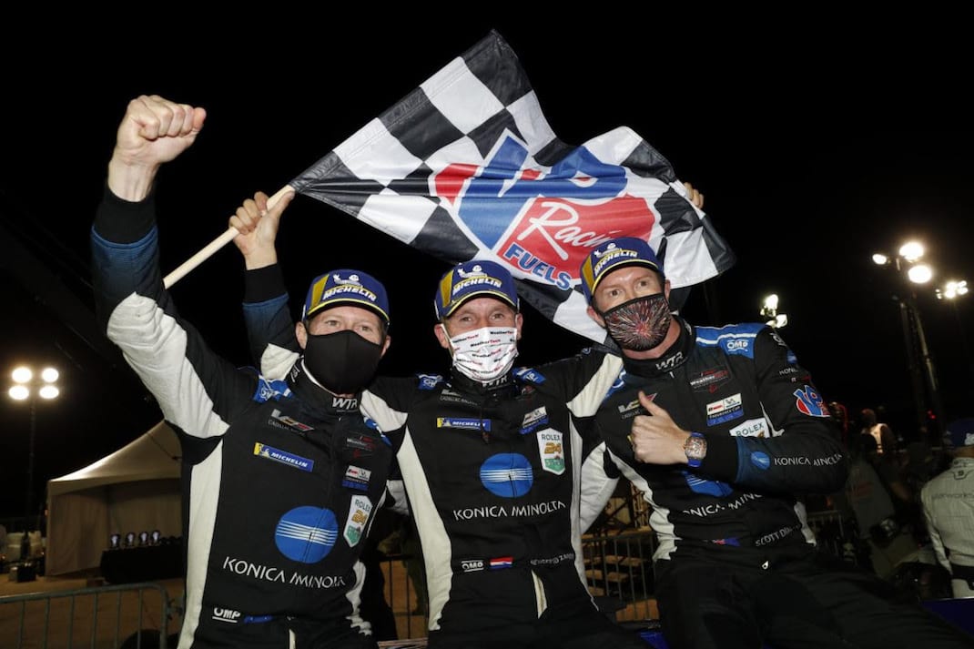 Wayne Taylor Racing teammates Scott Dixon, Renger van der Zande and Ryan Briscoe celebrate winning Saturday's Petit Le Mans. (IMSA photo)