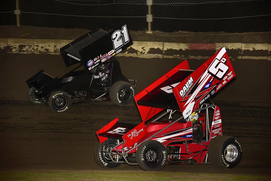 Zach Daum (5) battles to the inside of Carson Short during Friday's Built Ford Tough MOWA Sprint Car Series event at Jacksonville Speedway. (Mark Funderburk Photo)
