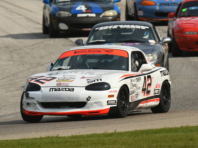 Preston Pardus overcame a 77-car field to win the Spec Miata portion of the SCCA National Championship Runoffs on Friday at Road America.