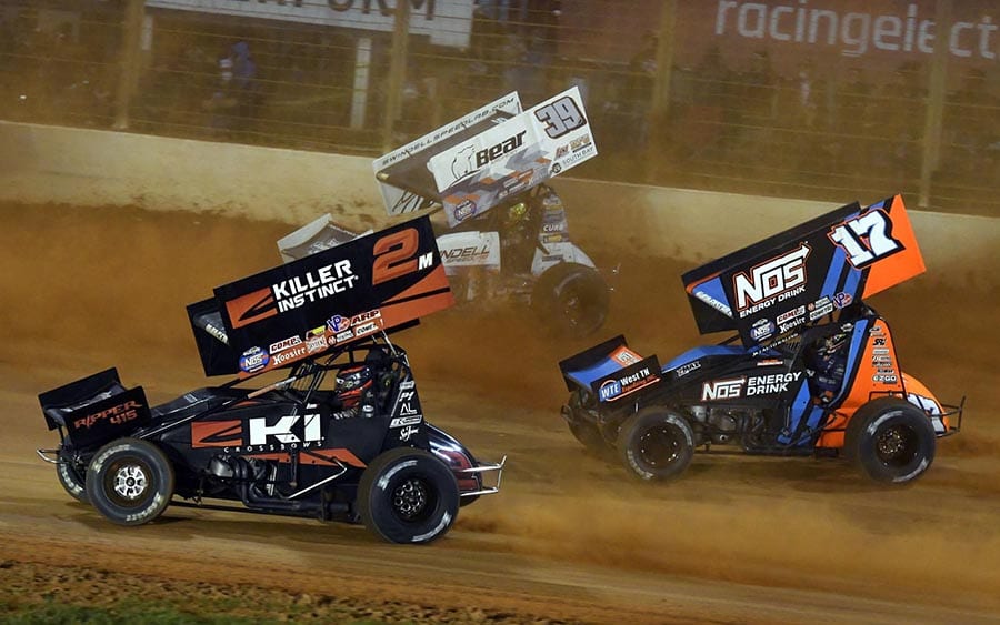 Kerry Madsen (2), Sheldon Haudenschild (17) and Spencer Bayston race for position during Saturday's World of Outlaws NOS Energy Drink Sprint Car Series event at The Dirt Track at Charlotte. (Frank Smith Photo)