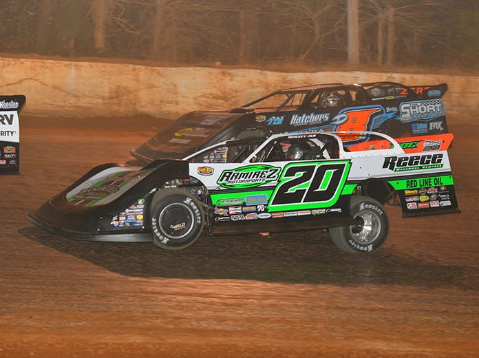 Jimmy Owens (20) battles Dustin Linville on his way to victory Saturday at 411 Motor Speedway. (Michael Moats Photo)