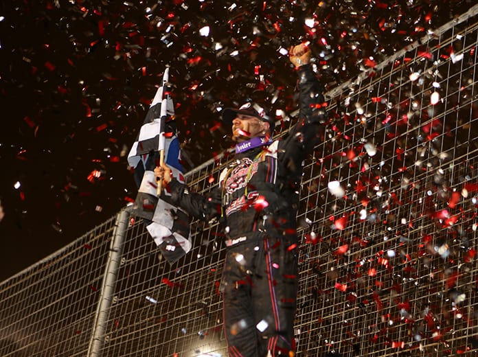 Brandon Overton celebrates after his victory Wednesday at The Dirt Track at Charlotte. (Adam Fenwick Photo)