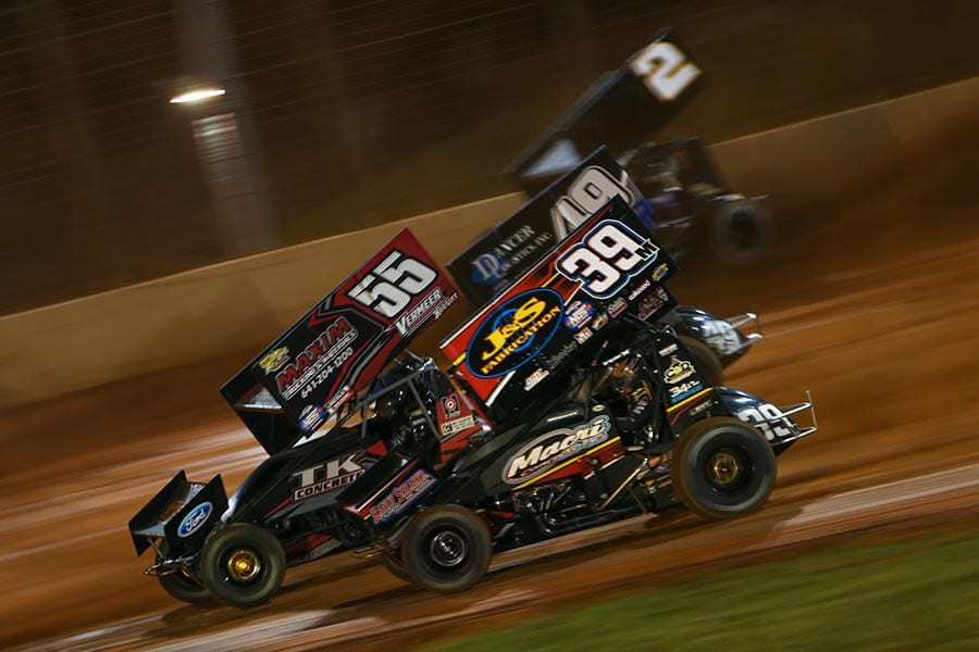 Anthony Macri (39), Hunter Schuerenberg (55), Shawn Dancer (49) and Bill Balog battle during the B-Main as part of Friday's World of Outlaws NOS Energy Drink Sprint Car Series event at The Dirt Track at Charlotte. (Adam Fenwick Photo)