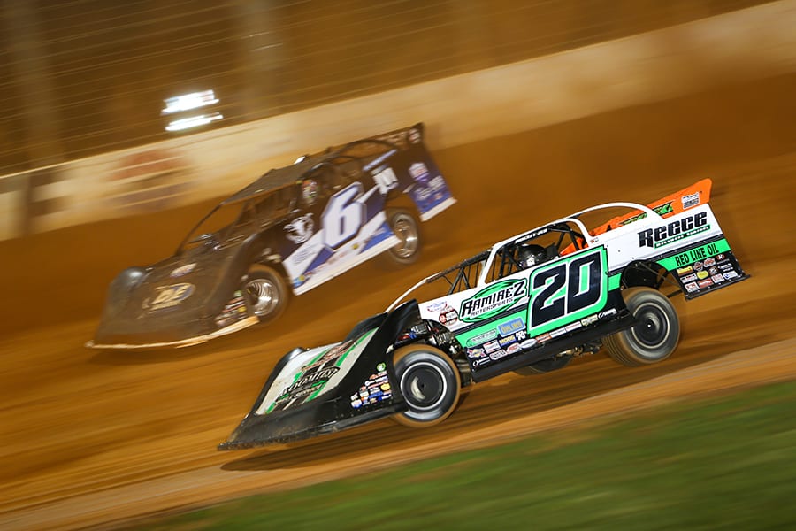 Jimmy Owens (20) battles Kyle Larson during Wednesday's World of Outlaws Morton Buildings Late Model Series event at The Dirt Track at Charlotte. (Adam Fenwick Photo)