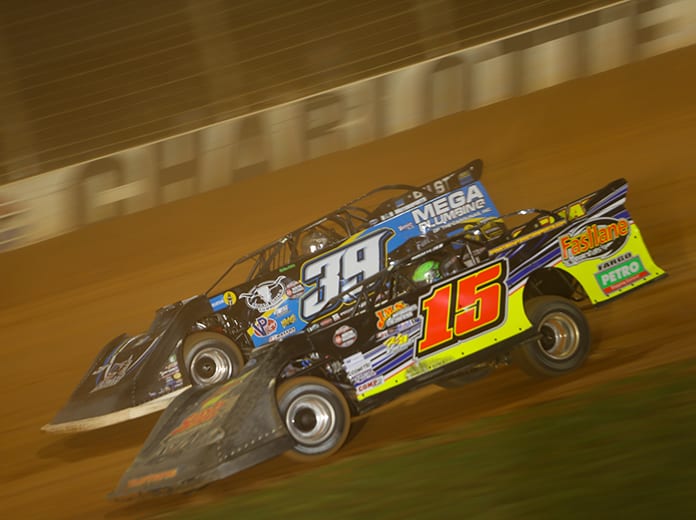 Donny Schatz (15) races under Tim McCreadie during Wednesday's World of Outlaws Late Model Series feature at The Dirt Track at Charlotte. (Adam Fenwick Photo)