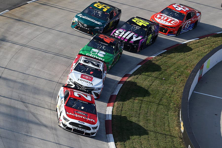 Matt DiBenedetto (21) leads a pack of cars during Sunday's Xfinity 500 at Martinsville Speedway. (Brian Lawdermilk/Getty Images Photo)