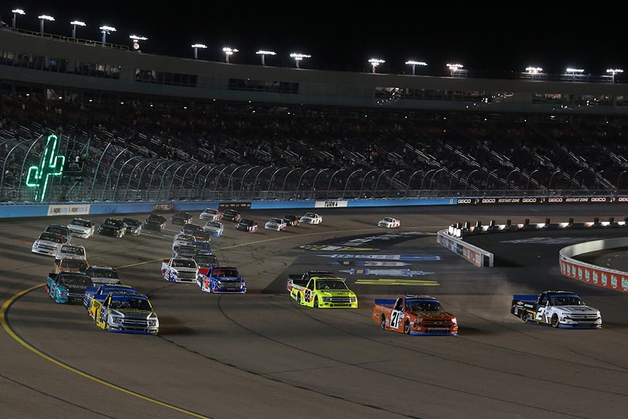 Drivers spread out across the track early in Friday's NASCAR Gander RV & Outdoors Truck Series event at Phoenix Raceway. (Brian Lawdermilk/Getty Images Photo)