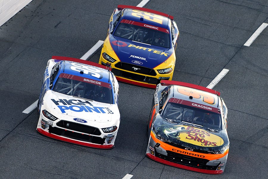 Noah Gragson (9), Chase Briscoe (98) and Austin Cindric battle for position Saturday at Martinsville Speedway. (Brian Lawdermilk/Getty Images Photo)